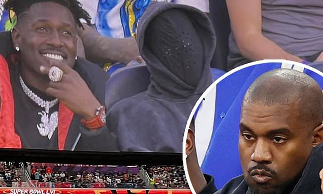 Kanye West is BOOED at Super Bowl LVI as he attends game with children North, 8, and Saint, 6
