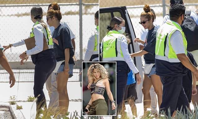 Shakira smiles as she is seen for the first time since it emerged she faces EIGHT YEARS in prison