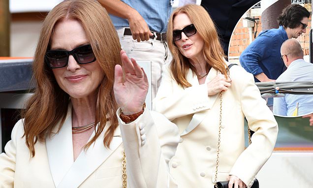 Julianne Moore greets fans with a wave as she prepares for jury duty at the Venice Film Festival