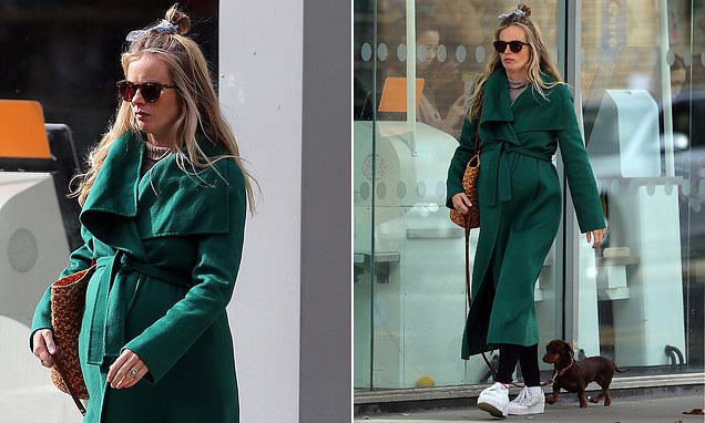 Pregnant Cressida Bonas steps out in London wearing a green coat over her growing baby bump