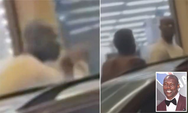 TO scores KO! Terrell Owens is caught fist fighting heckler outside CVS