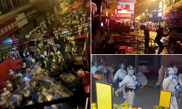 China protests: Protesters clash with hazmat-clad Covid-enforcers