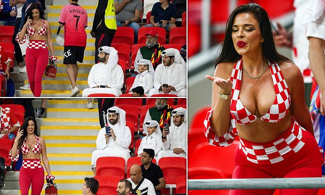 Hilarious moment two men catch sight of Miss Croatia and quickly reach for their phones at World Cup