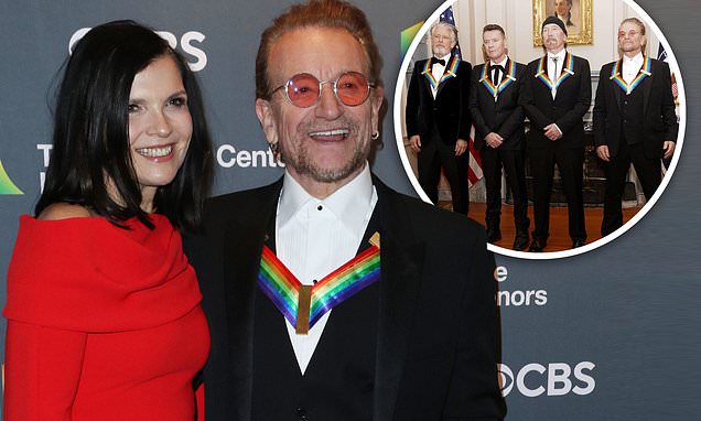 Bono flashes proud smile alongside wife Ali Hewson... as U2 receives Kennedy Center Honors